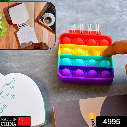 Spiral notebook with It fidget toy